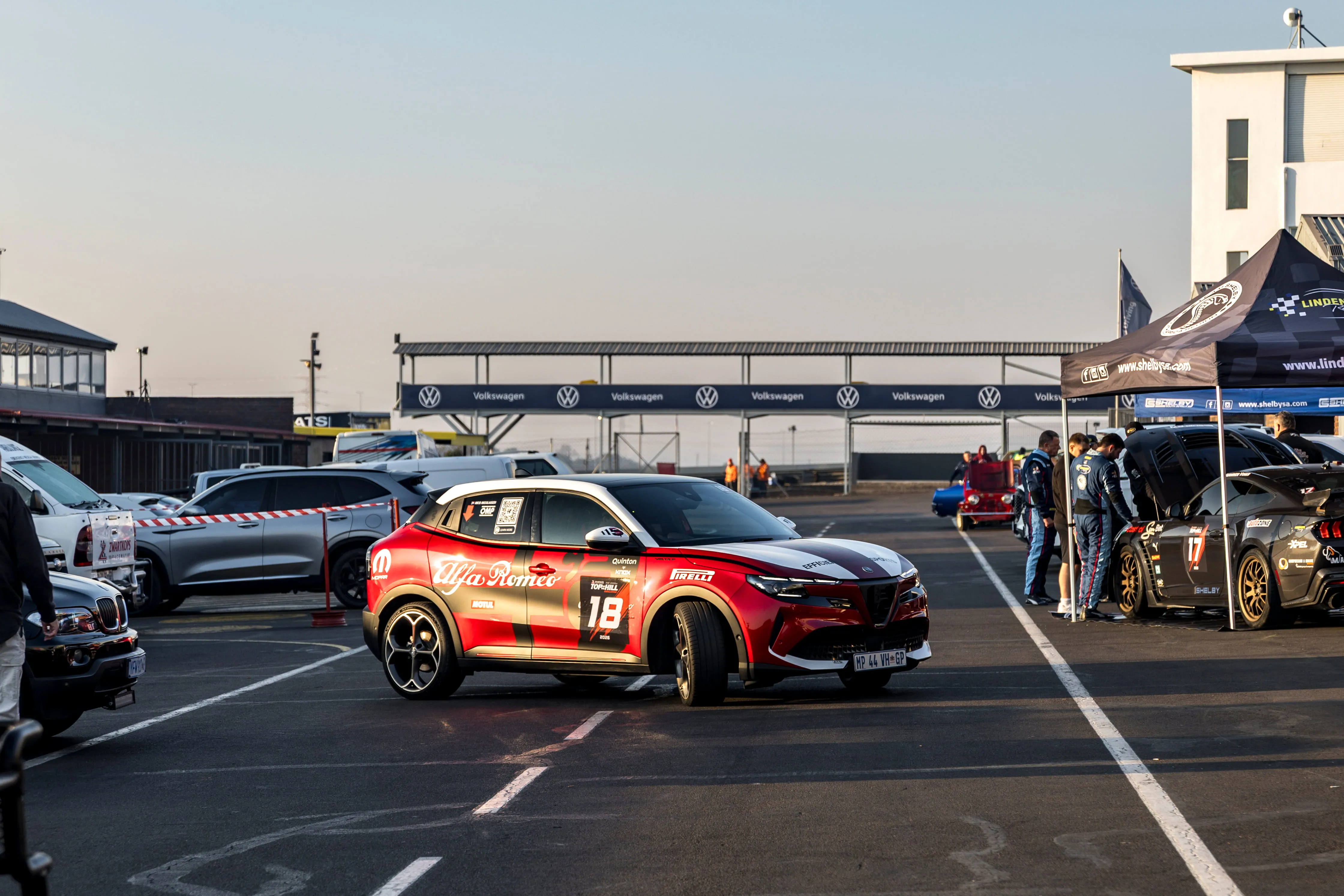 Efficiency Motorsports scene in the pits with cars, team activity and race-weekend atmosphere